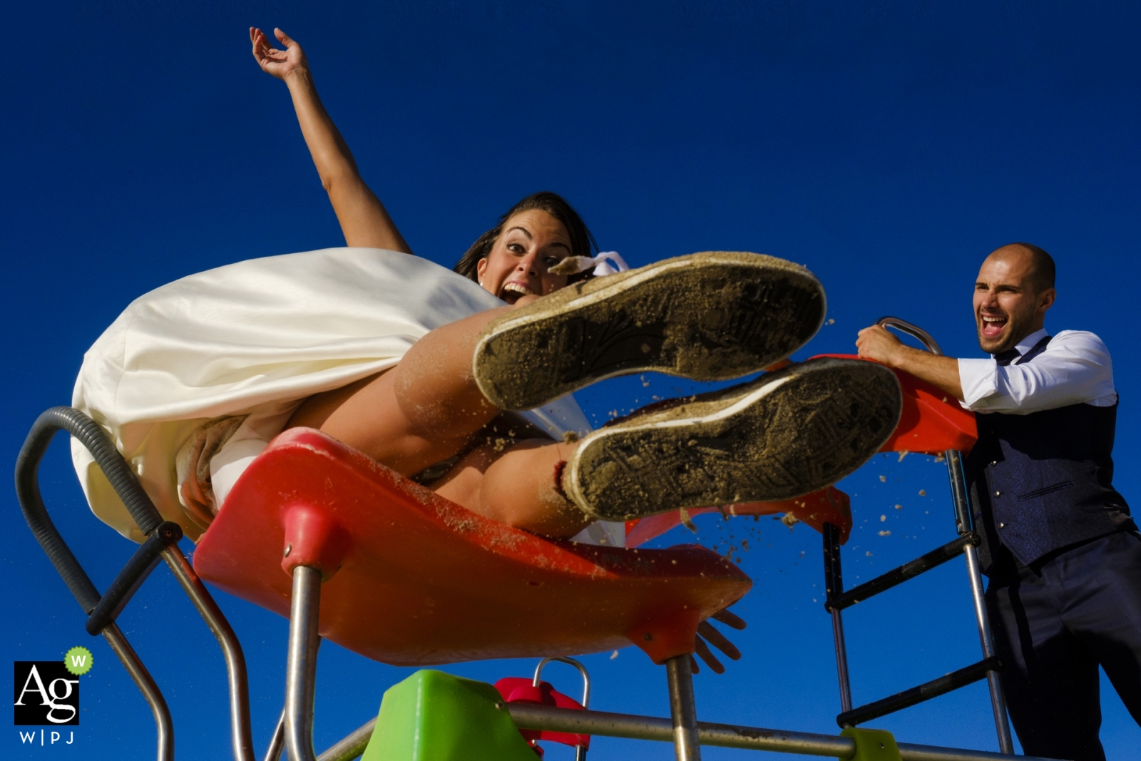 A wedding photo in Valencia shows a couples playful side outdoors.