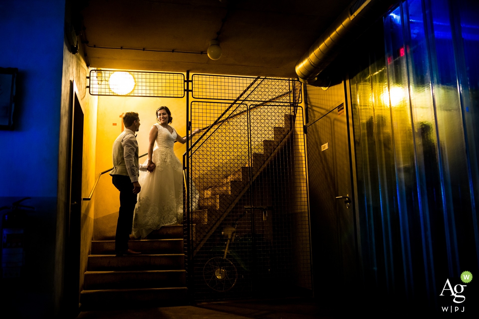 Photo by: <a href="https://www.wpja.com/photos/artistic-wedding-photographers-portrait/2271316">Matouš Bárta - Prague Prague Wedding Photographers | Image contains: bride, groom, portrait, dress, suit, stairwell