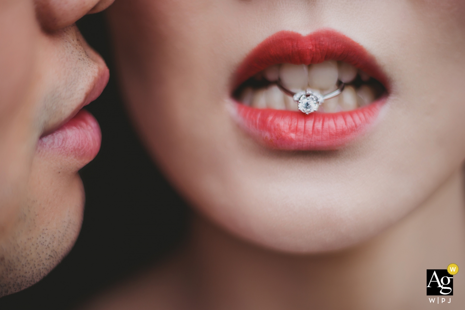 Photo by: <a href="https://www.wpja.com/photos/artistic-wedding-photographers-details/2309066">Henry Xu - Fuzhou Fujian pictures by a creative wedding photographer | detail of groom and bride with ring in her teeth