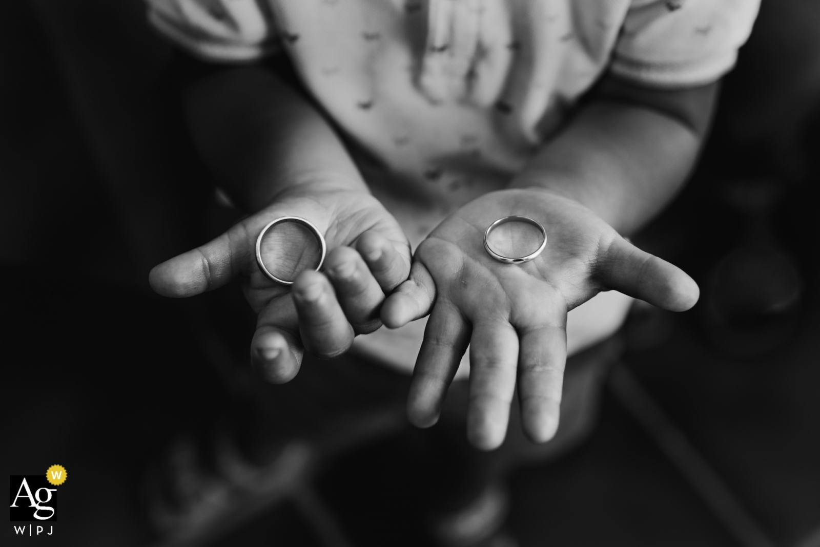 Photo by: <a href="https://www.wpja.com/photos/artistic-wedding-photographers-details/2315436">Monika Zaldo - Zaldibia Guipuzcoa Gipuzkoa creative wedding photography | detail of wedding rings in child's hands