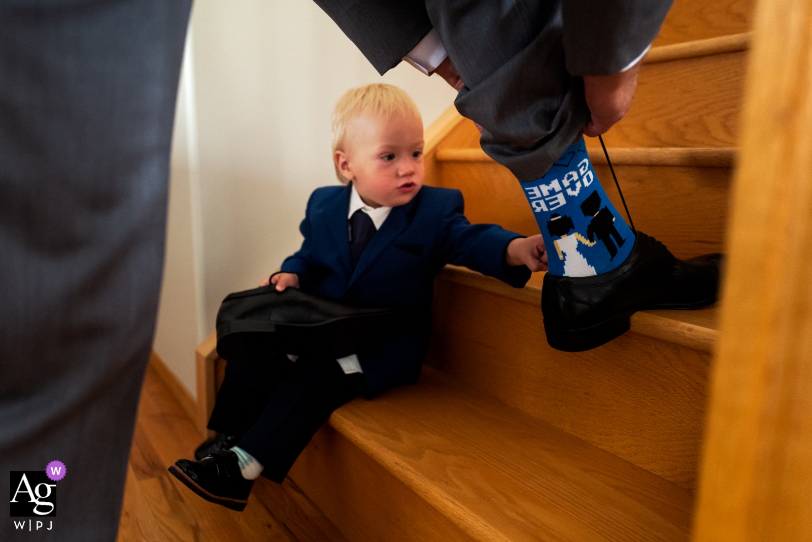 Photo by: <a href="https://www.wpja.com/photos/artistic-wedding-photographers-details/2317661">Dorota Karpowicz - Edmonton Alberta Alberta pictures by a creative wedding photographer | detail of groom's socks with toddler boy