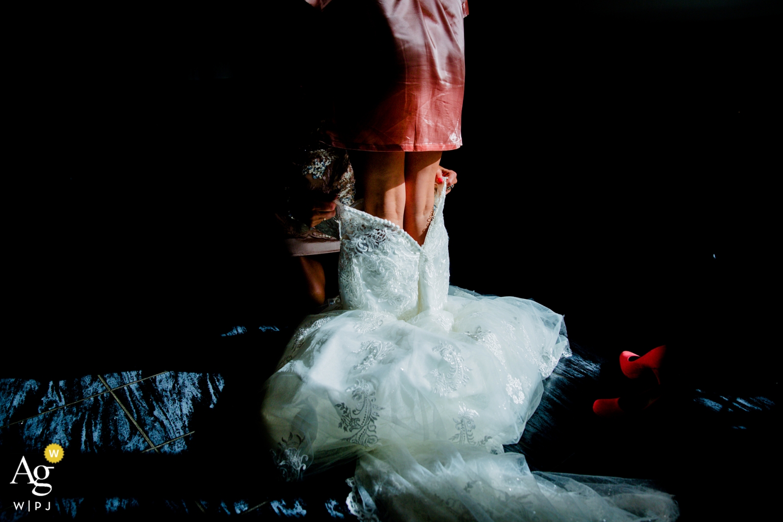 Photo by: <a href="https://www.wpja.com/photos/artistic-wedding-photographers-details/2318361">Gerhard Nel - The Hague Zuid Holland Netherlands artistic creative photography detail of wedding dress going on