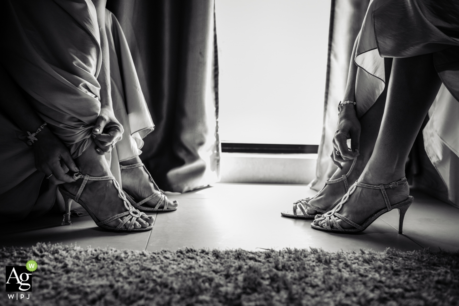 A wedding photo from Zabeel Saray Dubai shows bridesmaids slipping on their shoes