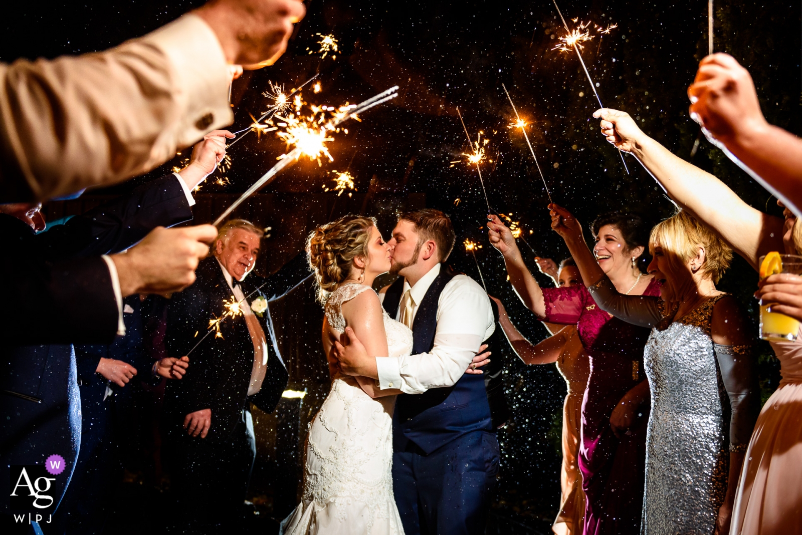 Photo by: <a href="https://www.wpja.com/photos/artistic-wedding-photographers/2440661">Kelly Giardina - Middlesex New Jersey Rock Island Lake Club wedding photography - Rain did not stop this couples sparkler exit