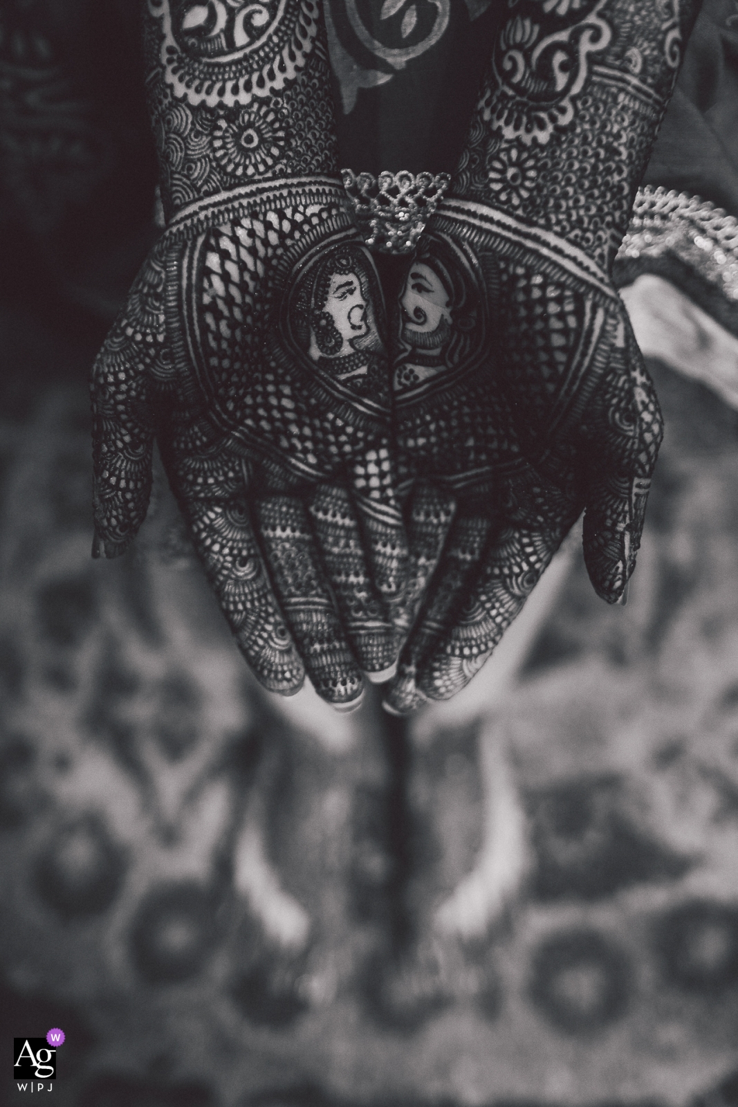 A San Jose, CA black and white detail shot depicting the decorated hands of a bride and groom - Prince & Princess Mehndi