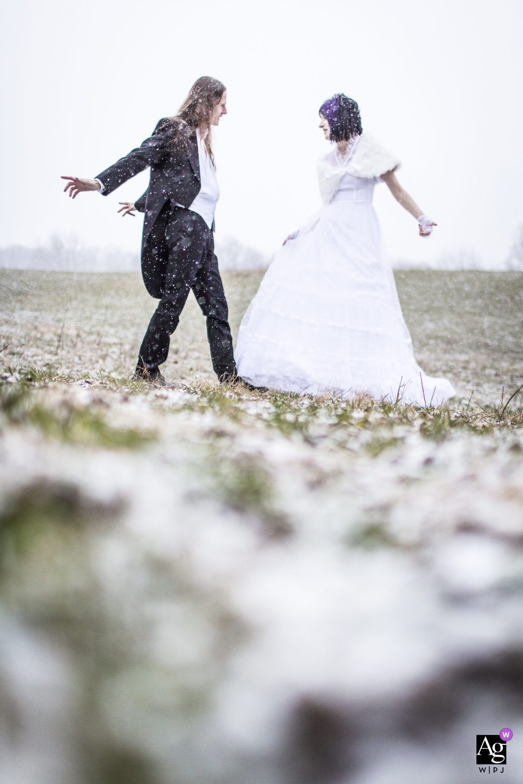 Photo by: <a href="https://www.wpja.com/photos/artistic-wedding-photographers/2441946">Andrew Morrell - Winchester Virginia comus Inn; Dickerson, MD wedding photos - Bride and Groom dancing in the snow