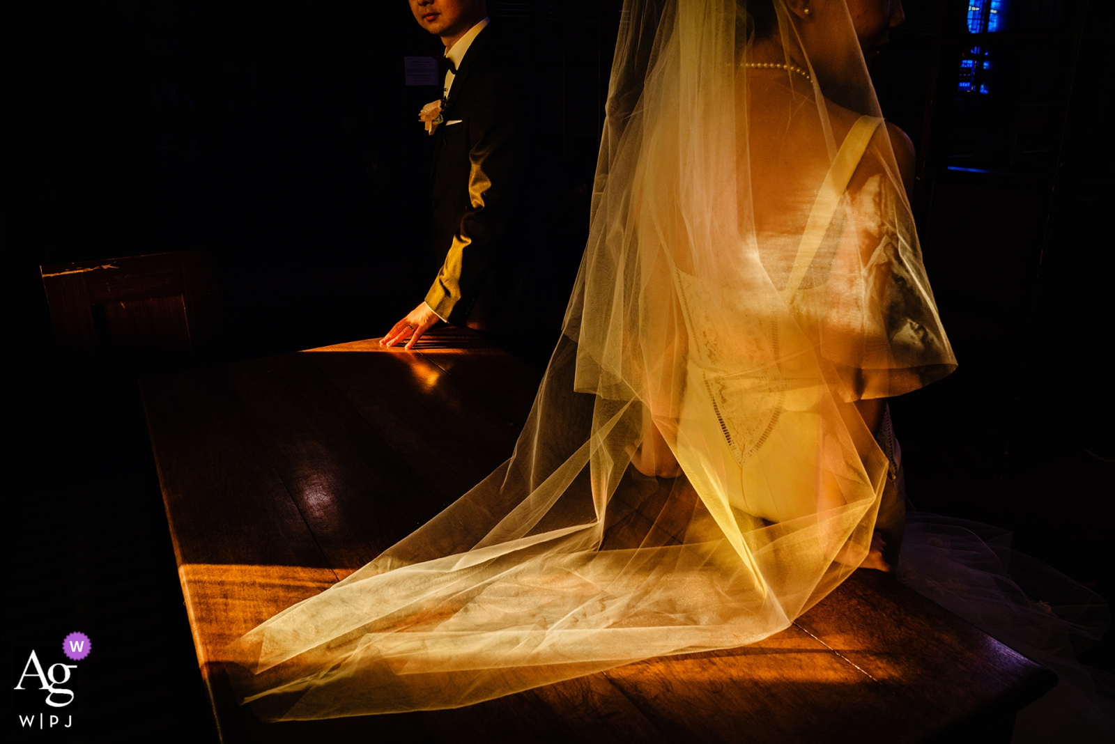 Photo by: <a href="https://www.wpja.com/photos/artistic-wedding-photographers/2443326">Wenjie Han - Long Island City New York Goddard Chapel, Medford wedding photographer | natural lighting through church window is illuminating the bride and groom