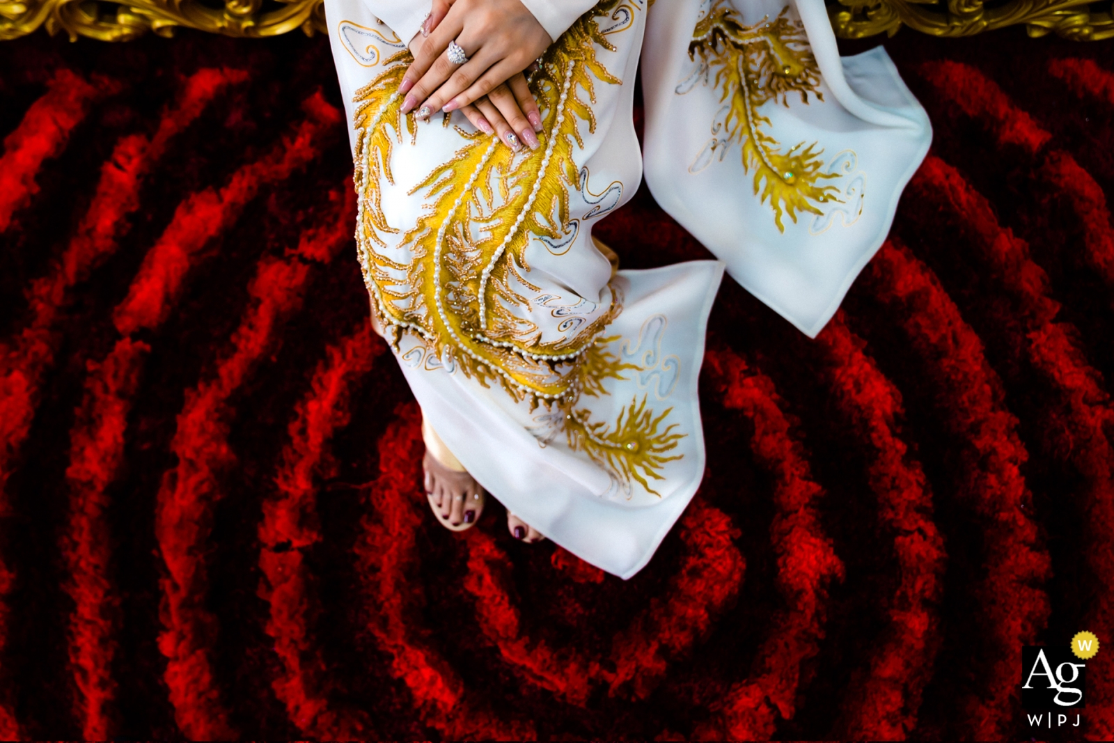 Photo by: <a href="https://www.wpja.com/photos/artistic-wedding-photographers/2448746">Vu Nguyen - Ho Chi Minh Vietnam HCMC wedding day photography | Detail Image of her hands dress and feet