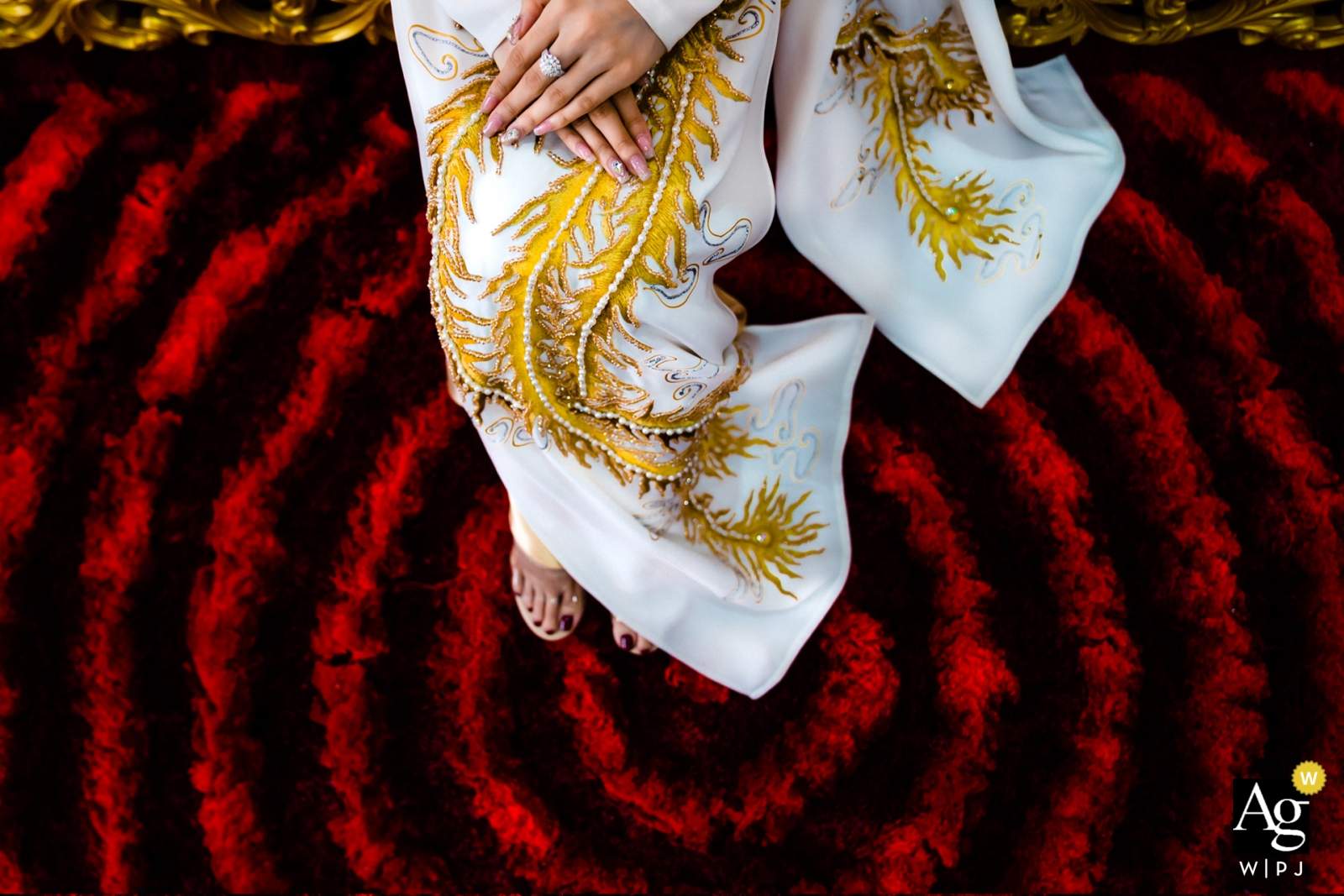 A Vietnamese wedding in Ho Chi Minh City featured intricate details of red circles decorations below the wedding attire