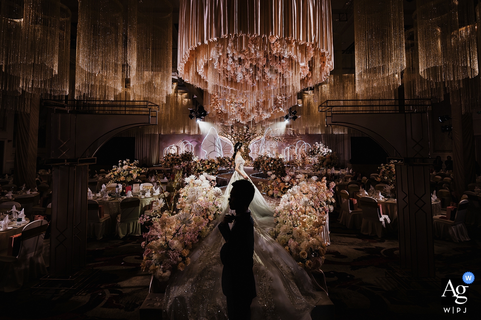 Nanping Hotel ceremony scene portrait of silhouetted groom and lit bride