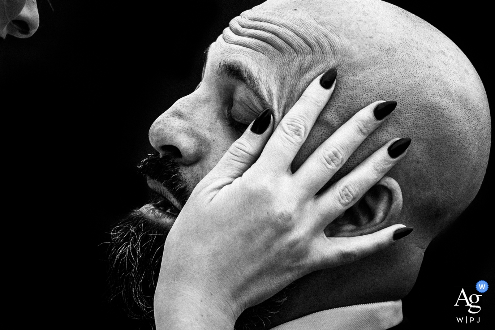 At York Mills Gallery, the bride tenderly wiped away the groom's tears in a black and white photo