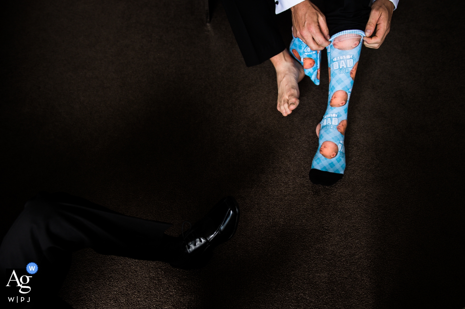 An image taken in Victoria, Australia, depicts the groom preparing for the wedding by donning novelty socks