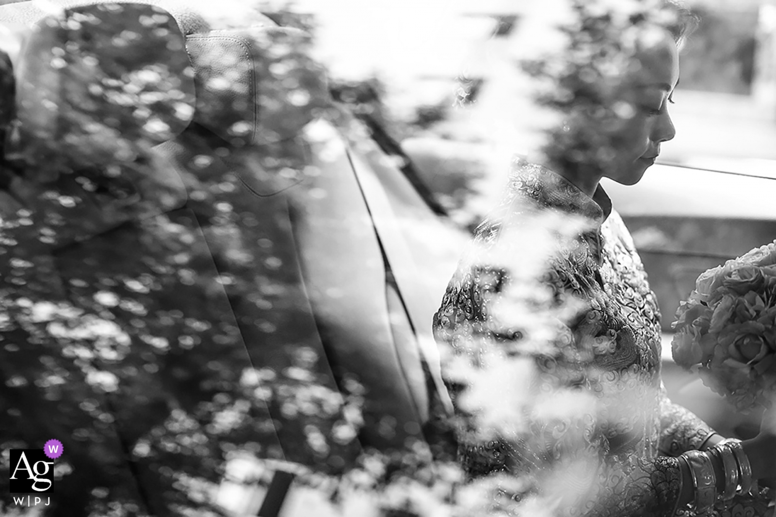 Zhuhai, China bridal portrait of the bride in a car with her bouquet