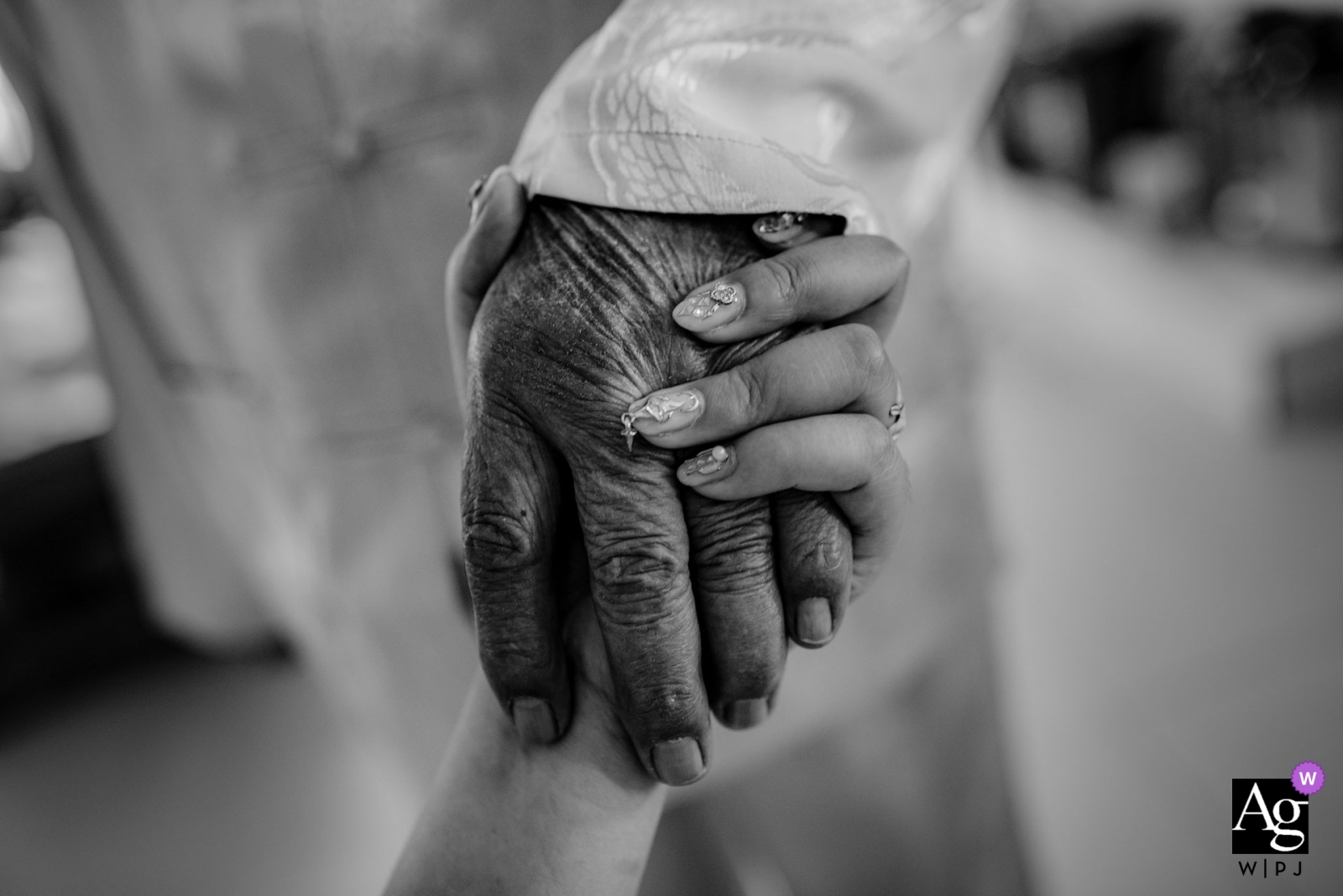   A black-and-white photograph taken in Shandong, China, shows a bride holding the hand of her grandfather