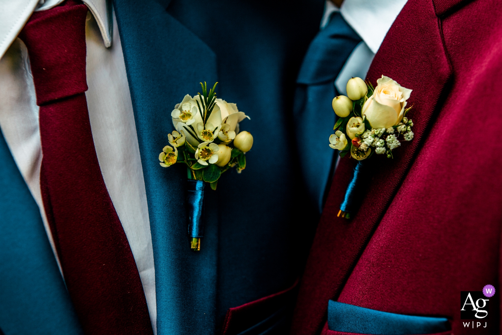 This wedding image captures two men in vibrant tuxedos, each adorned with a boutonnière at Szeged Dóm