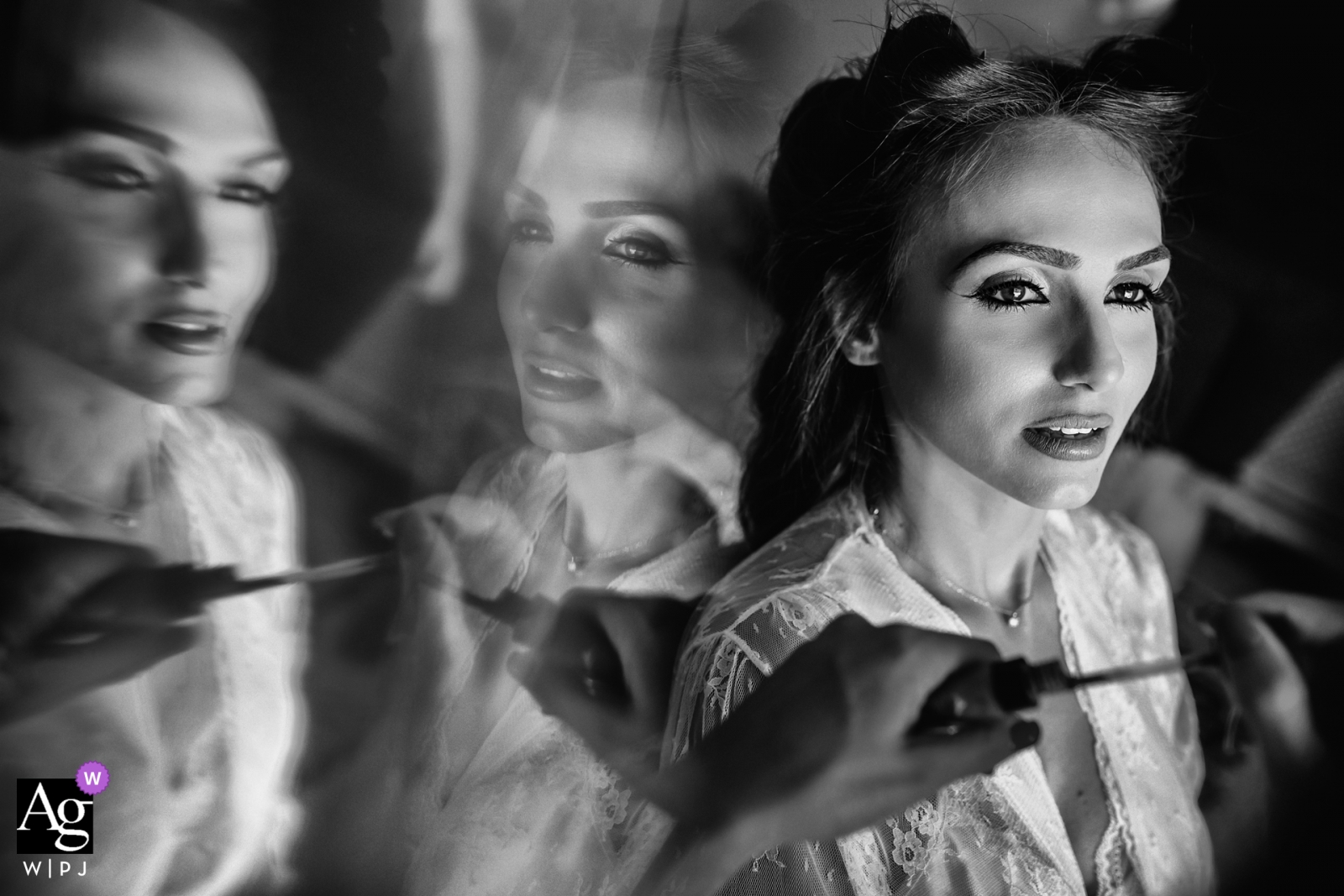 An Attica wedding photographer captures the bride's reflection in mirrors as she prepares for the special day before the ceremony begins in striking black and white