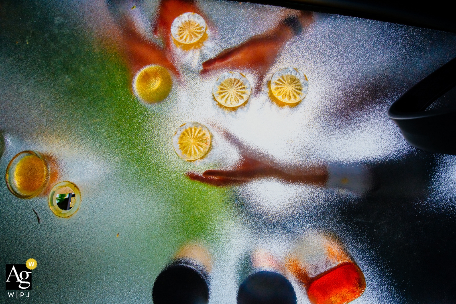 The muted light cascading through the diffused glass painted a whispery image of hands waiting to cheer a toast of love and joy in a romantic wedding at the Royal Ambassador Banquet in Toronto, Ontario