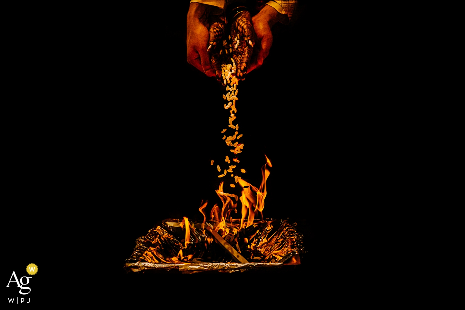 The traditional pouring over a vibrant fire against a dark backdrop captured every detail of the special day at the Paradise Banquet Hall in Ontario