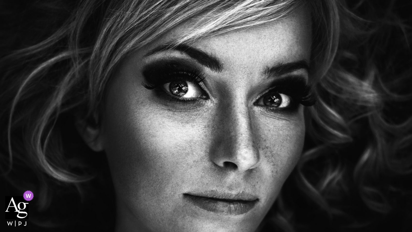 Wedding day close-up portrait of the bride in black and white.