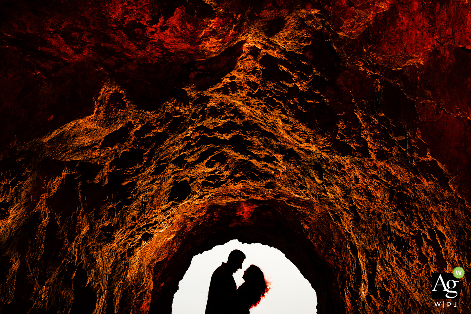 san francisco portrait of the bride and groom in an arched, rock cave in silhouette style