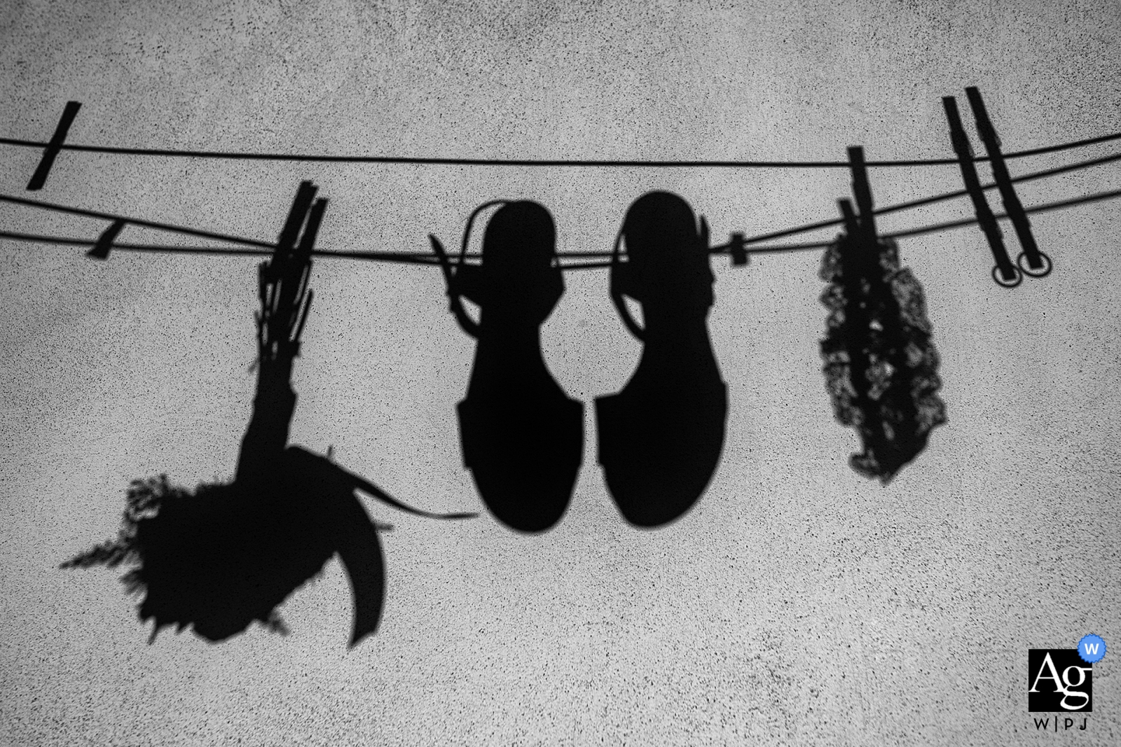 Reggio Calabria wedding detail photo of the bride's shoes, bouquet and garter hanging from a clothesline 