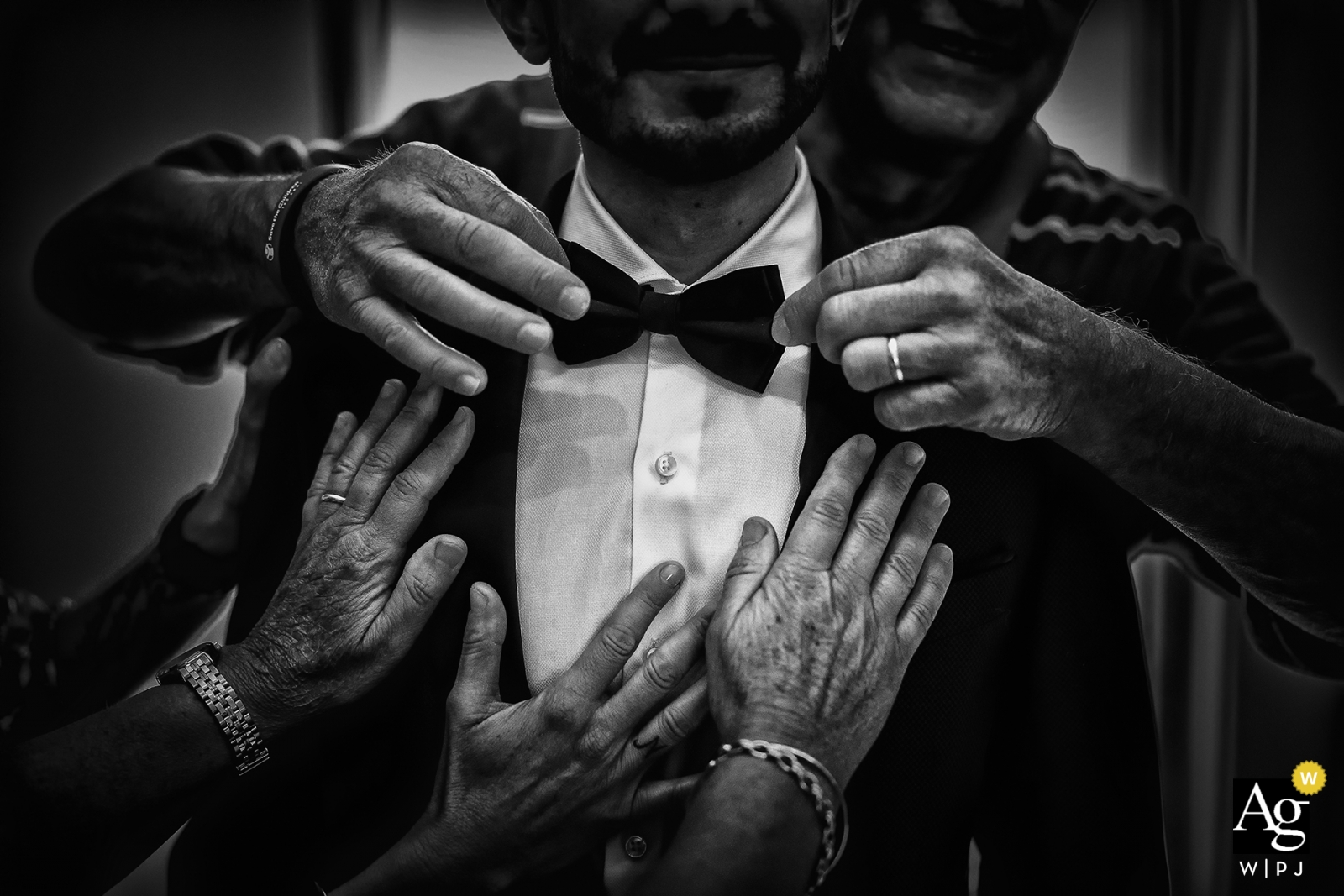 Cremona family preparing the groom for his wedding ceremony