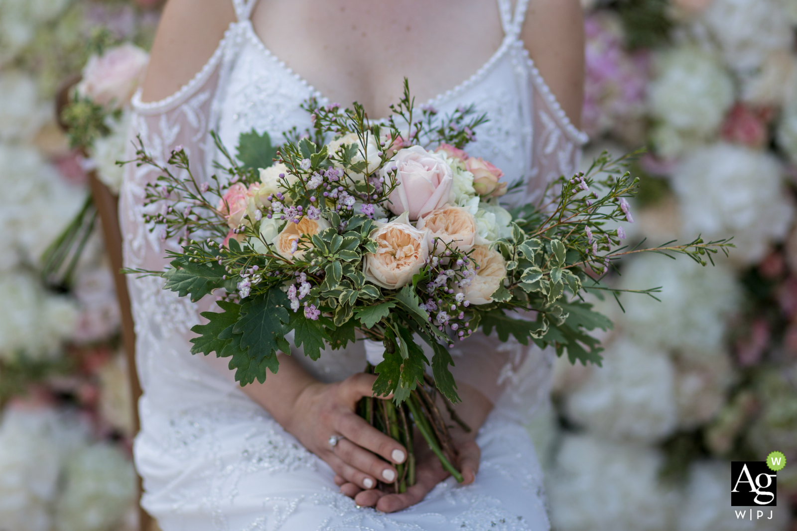 Wedding Reception and ceremony venue photos from "La Menuse" in Dordogne - Bride bouquet on floral wall 