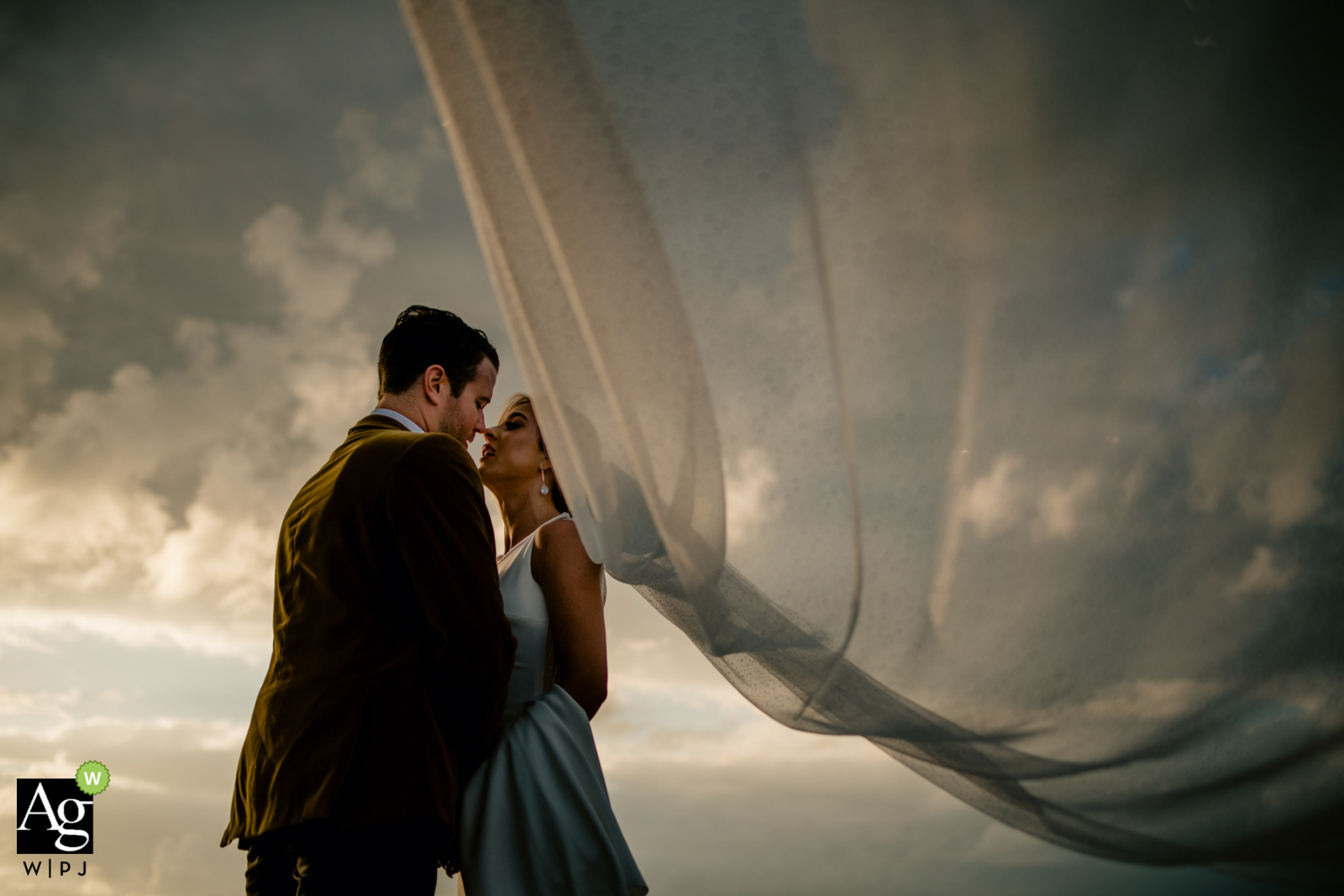Key West, Florida wedding photo of the bride and groom Fort Zachary Taylor, Key West, Florida wedding photographer said: Wind was blow 20 knots across the entire island. So that allowed me to use it to my advantage and just let the brides veil fly