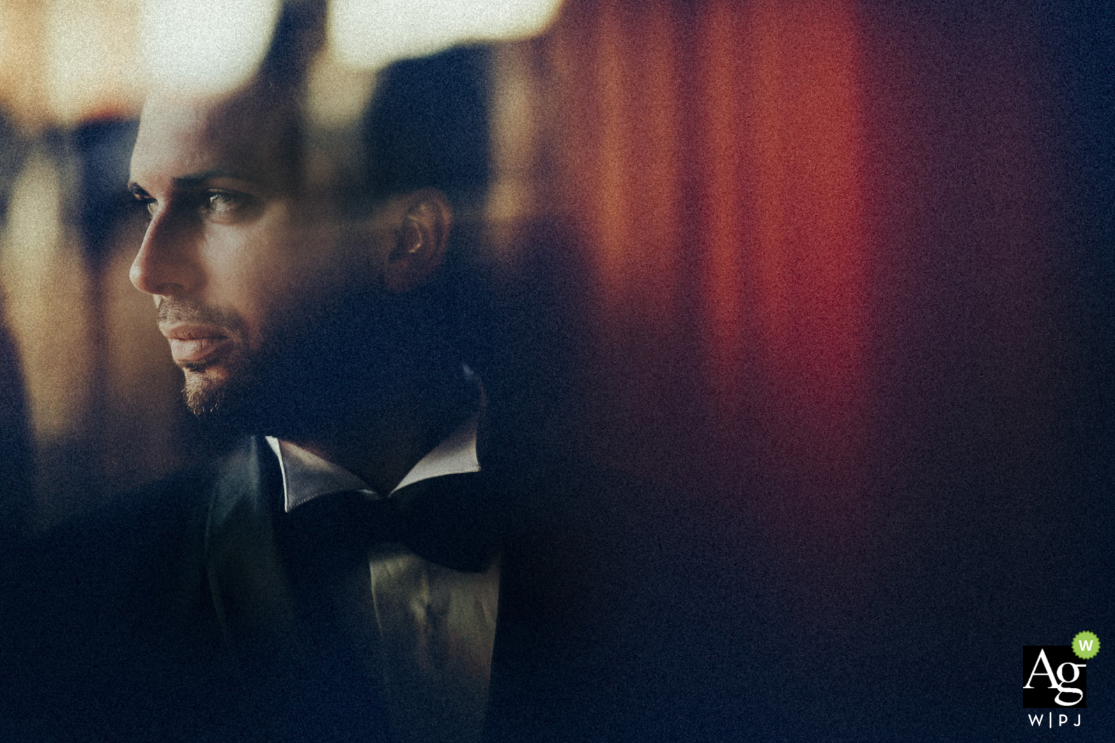 Potenza Basilicata wedding photographer working at Groom's house, near a window - Portrait of the groom during his getting ready, window light from the left 