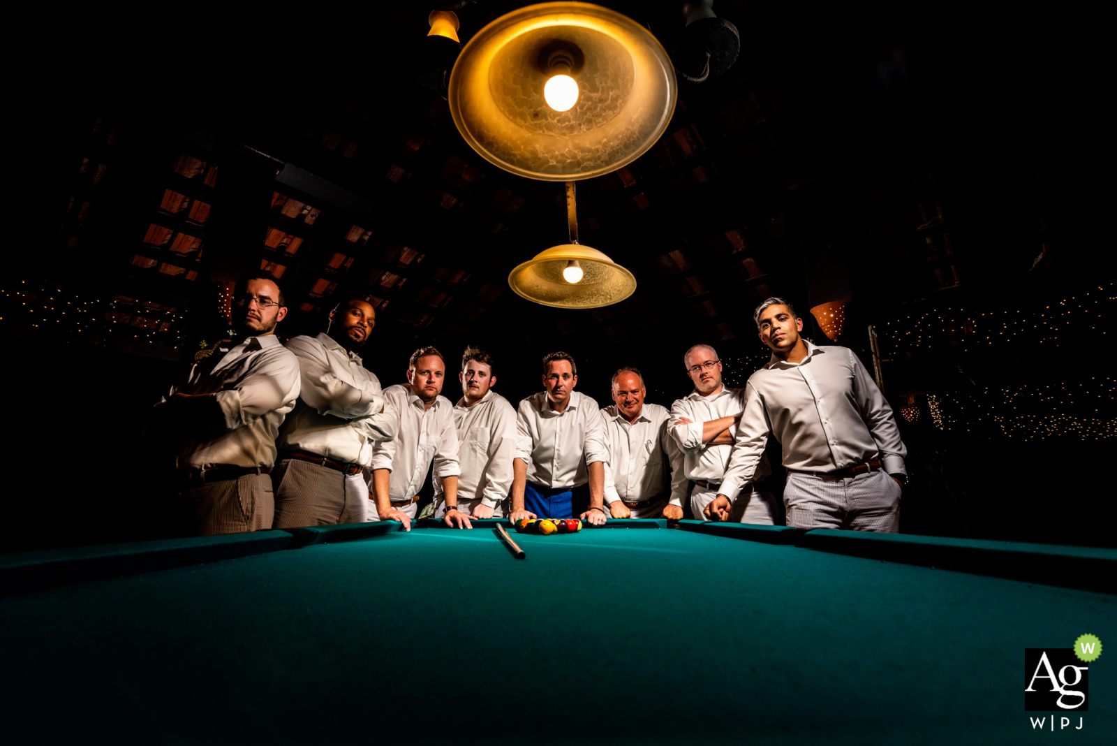 Alegre wedding venue portrait of the groom and groomsmen Reception- Hacienda Siesta Alegre wedding venue photographer: 1 light from right for subjects. 1 light behind for pop. Wide angle for leading lines