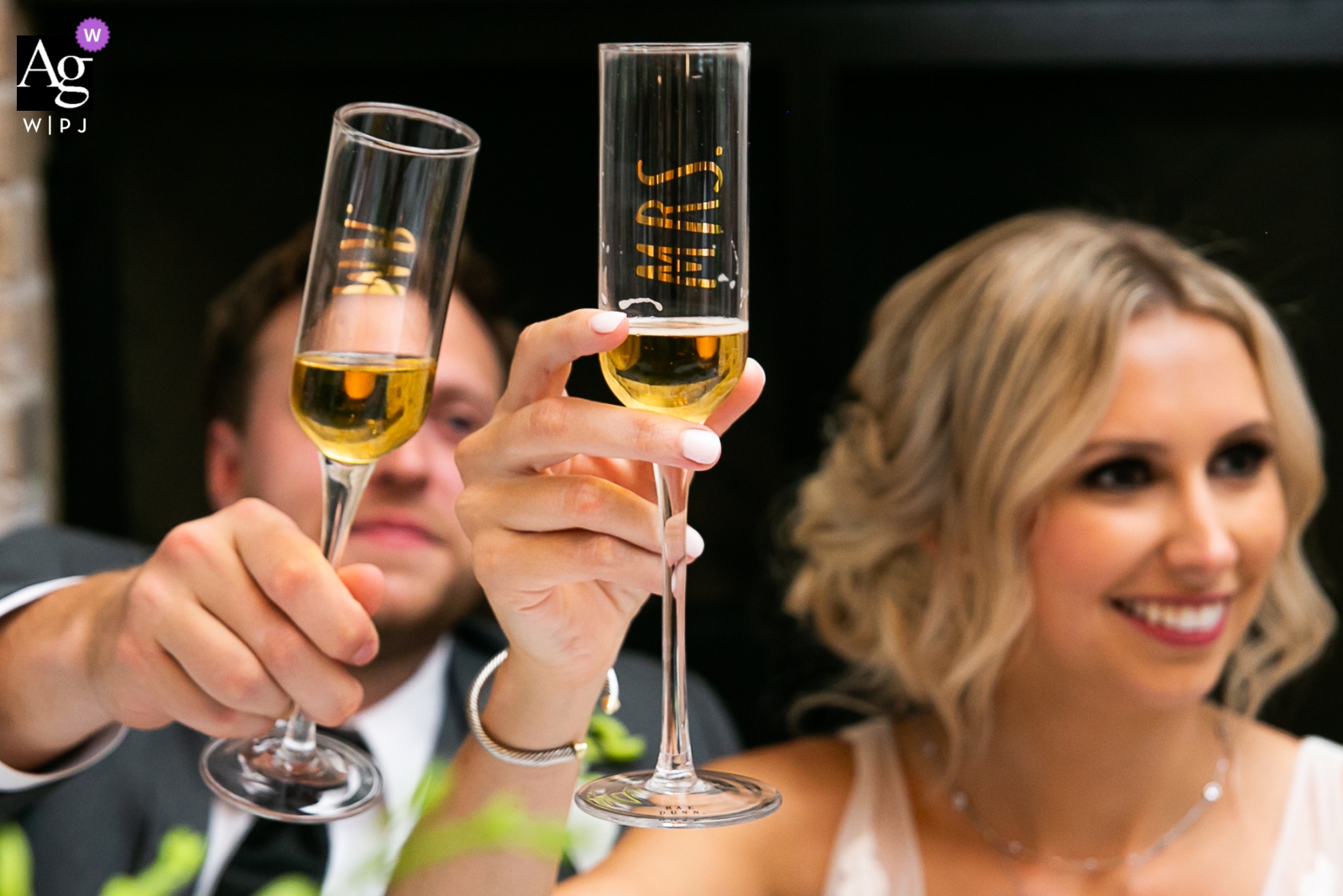 Wrightsville Manor, Wrightville, SC Wedding Couple Toasting Glasses at the Head Table 