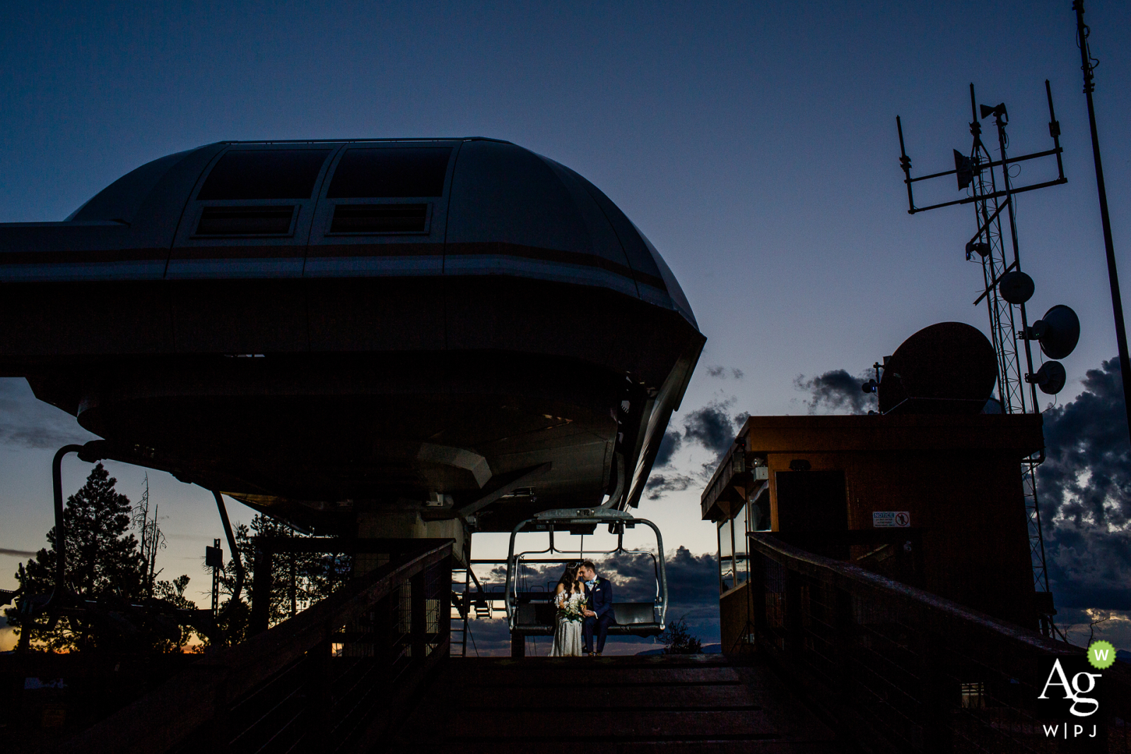 Denver Wedding Ceremony Photo at the ski lifts Denver Colorado Wedding Ceremony Photograph | Couple on ski lift at sunset