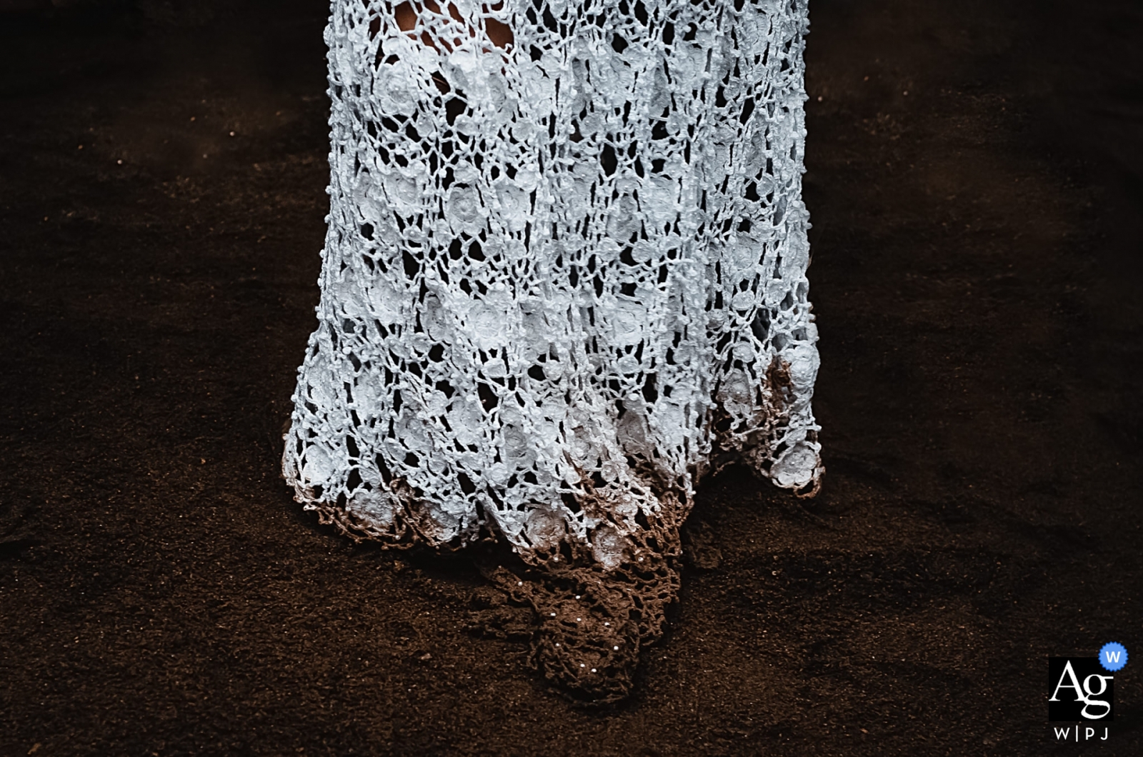 Photo by: <a href="https://www.wpja.com/photos/artistic-wedding-photographers/2574776">Lucas Coutinho - Nova Friburgo Rio de Janeiro Brazil Reception Venue Photographer: Detail of wedding dress dirty after party