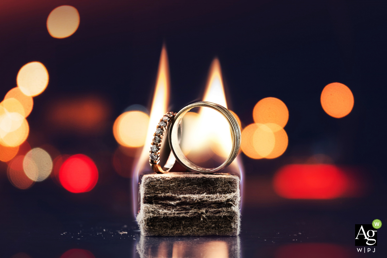 Miami Florida Wedding Photographer Said: During he party at the reception house I took this photo of weddings rings with a quick light BBQ and light of cars in the parking lot. 