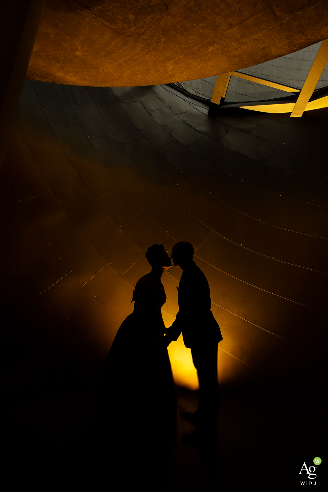 Alberta Wedding Ceremony Venue Photo of the Bride and Groom silhouetted against wall Alberta Wedding Ceremony Venue Photography | Bride and Groom are silhouetted against wall