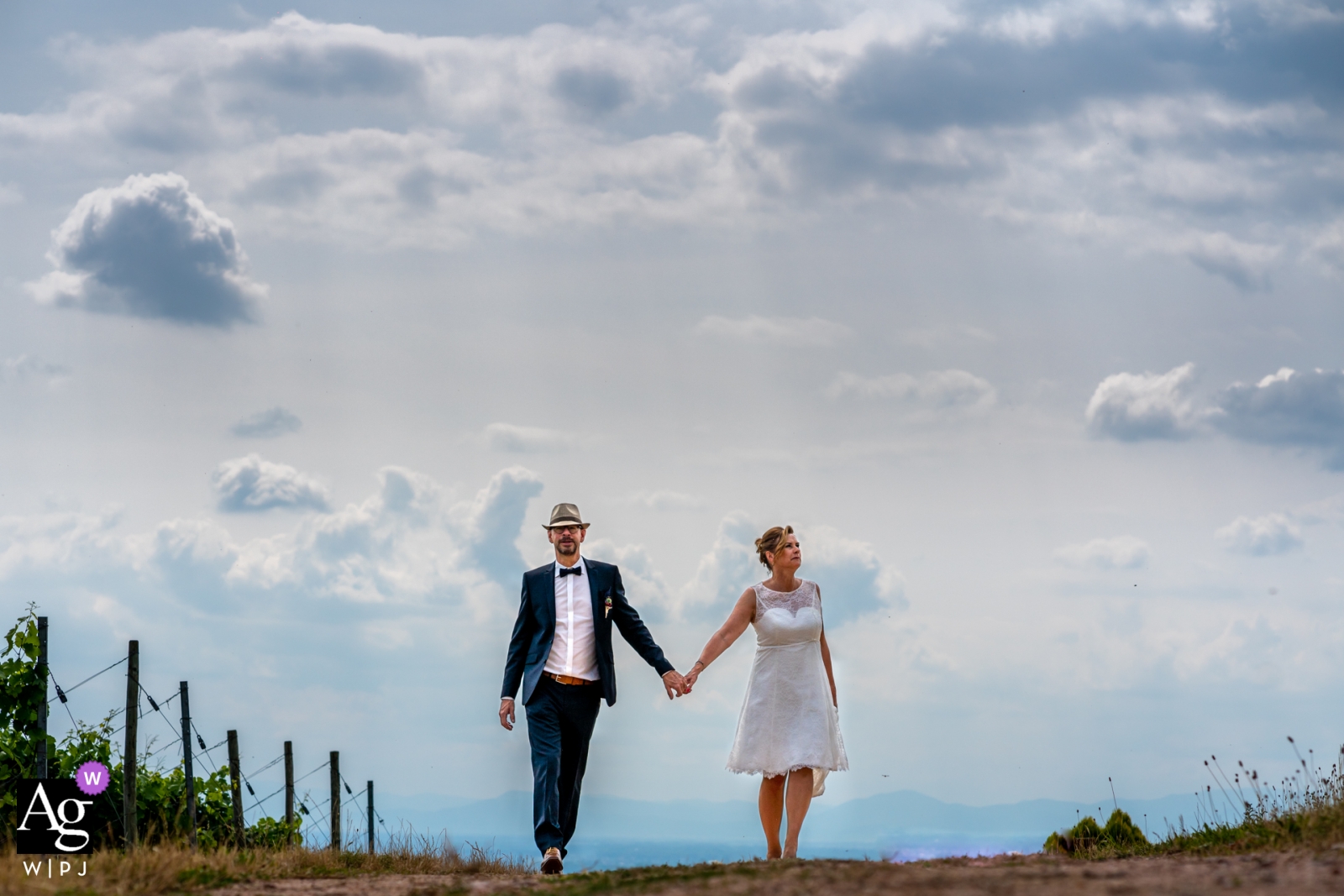 Durbach Couple walking together during Wedding portrait session under the clouds Durbach Couple walking together | Wedding portraits under the clouds