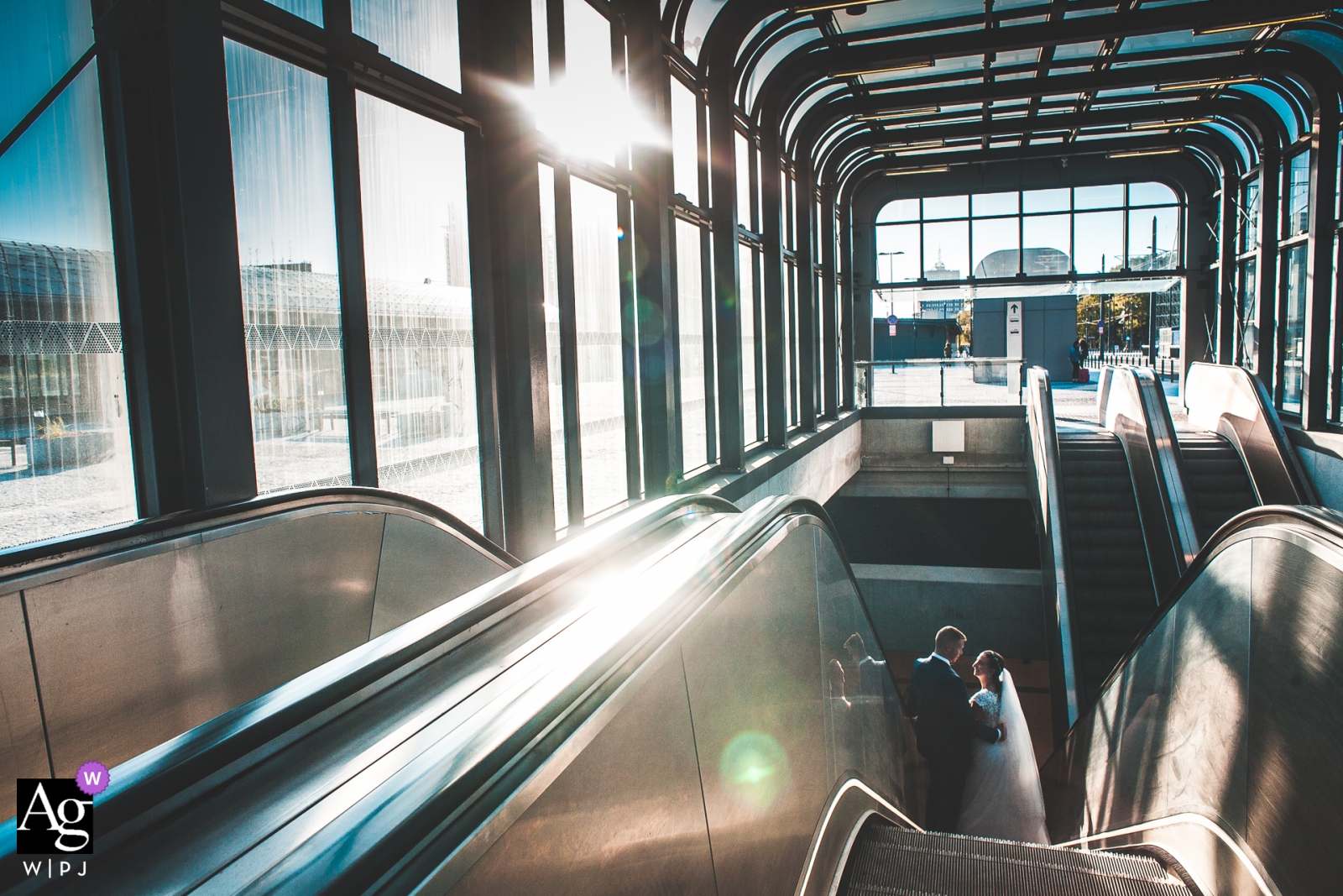 Lodz, Poland Wedding Portrait of A couple at an empty station on the escalator Lodz, Poland Wedding Portrait of A couple at an empty station.