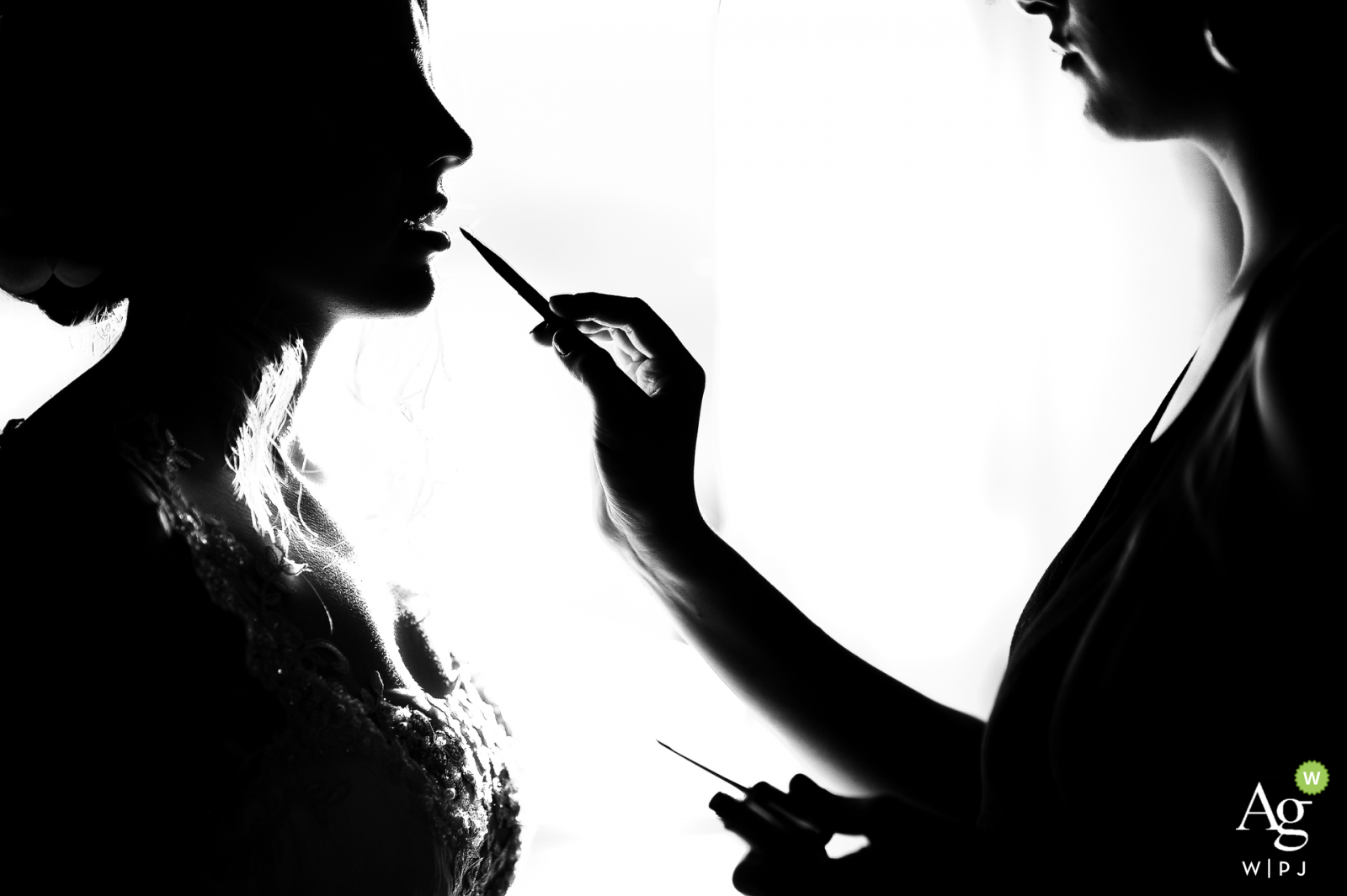 Monte Alegre do sul wedding venue photo - bride getting ready with lipstick in silhouette