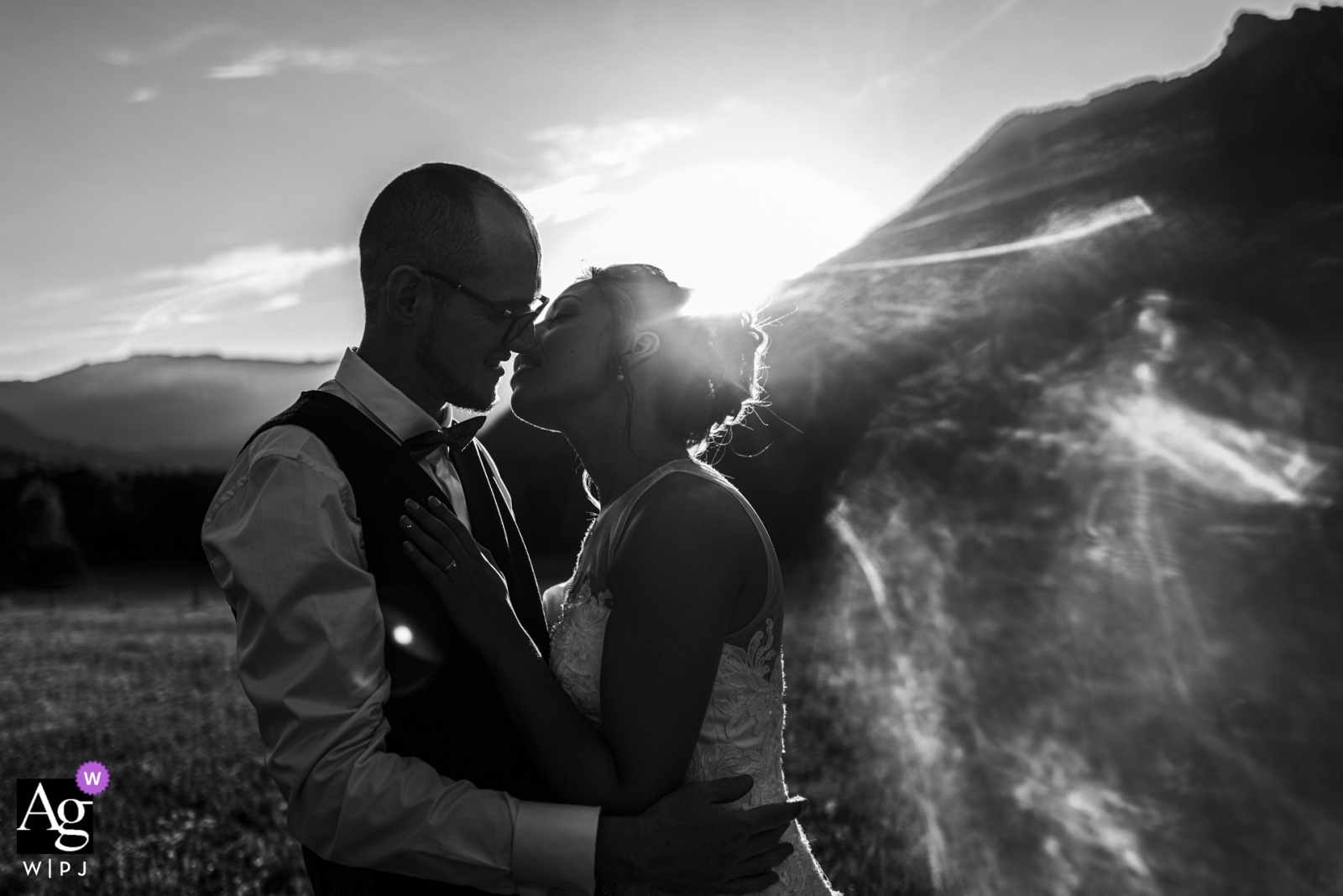 Auvergne-Rhône-Alpes reception venue wedding portrait of the bride and groom in a field at sunset