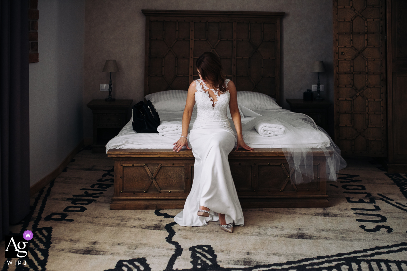 Best Western Hotel artistic wedding photo of a Lodzkie Podklasztorze, Sulejow, Poland Bride sitting on the bed in her room 