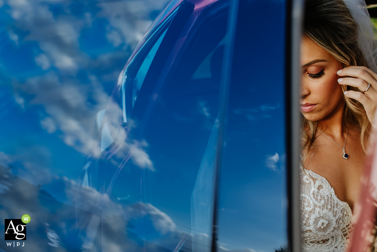 Photo by: <a href="https://www.wpja.com/photos/artistic-wedding-photographers/2589408">Renan Radici - Porto Alegre Rio Grande do Sul Casa dos Noivos, Xangri-lá, Brazil fine art wedding portrait image - Bride ready to get out of the car