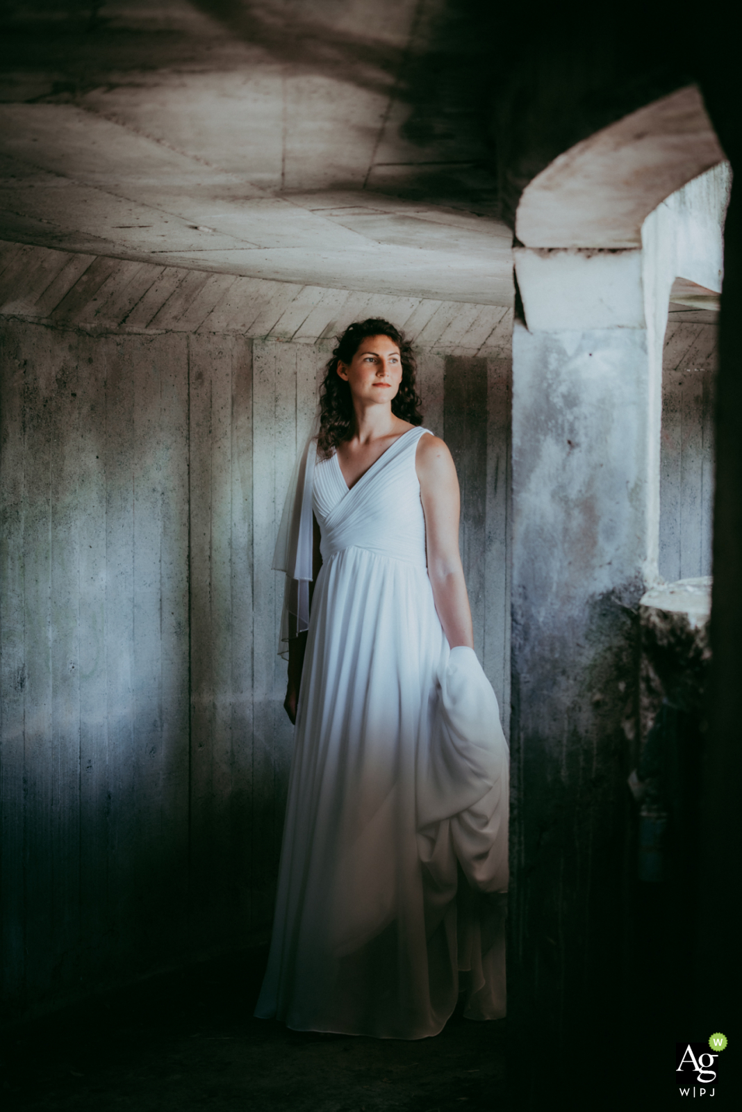 Shaanxi artistic wedding portrait created as the Bride poses in an old army shelter