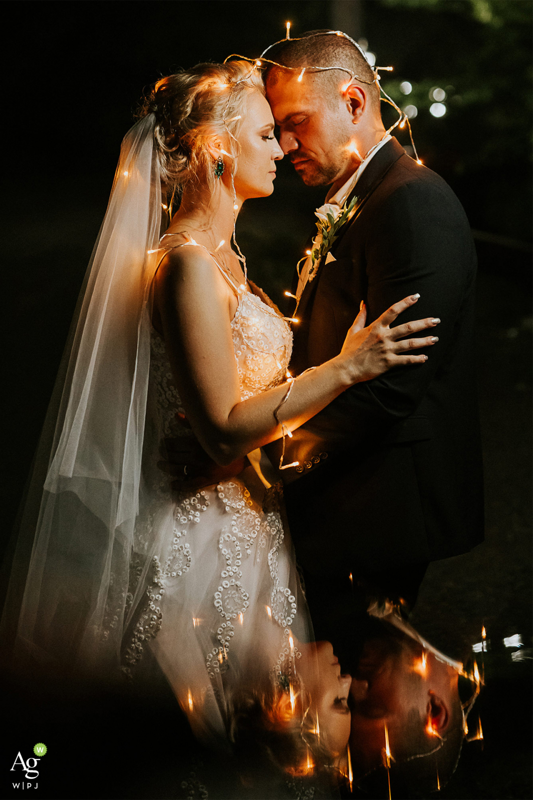 Banska Bystrica, Slovakia artistic wedding couple portrait of the Bride and Groom using tea lights and reflections