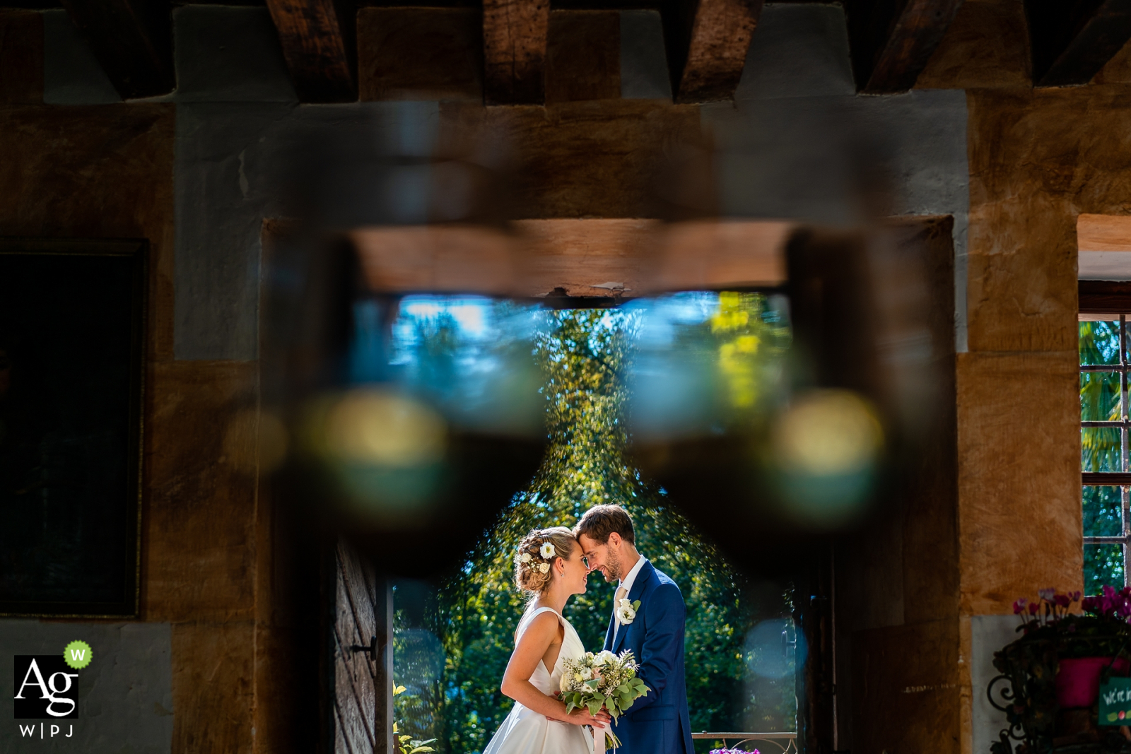 Castello di Strassoldo, Udine, Italy fine art wedding portrait image using the Bride and groom in the middle of the glasses