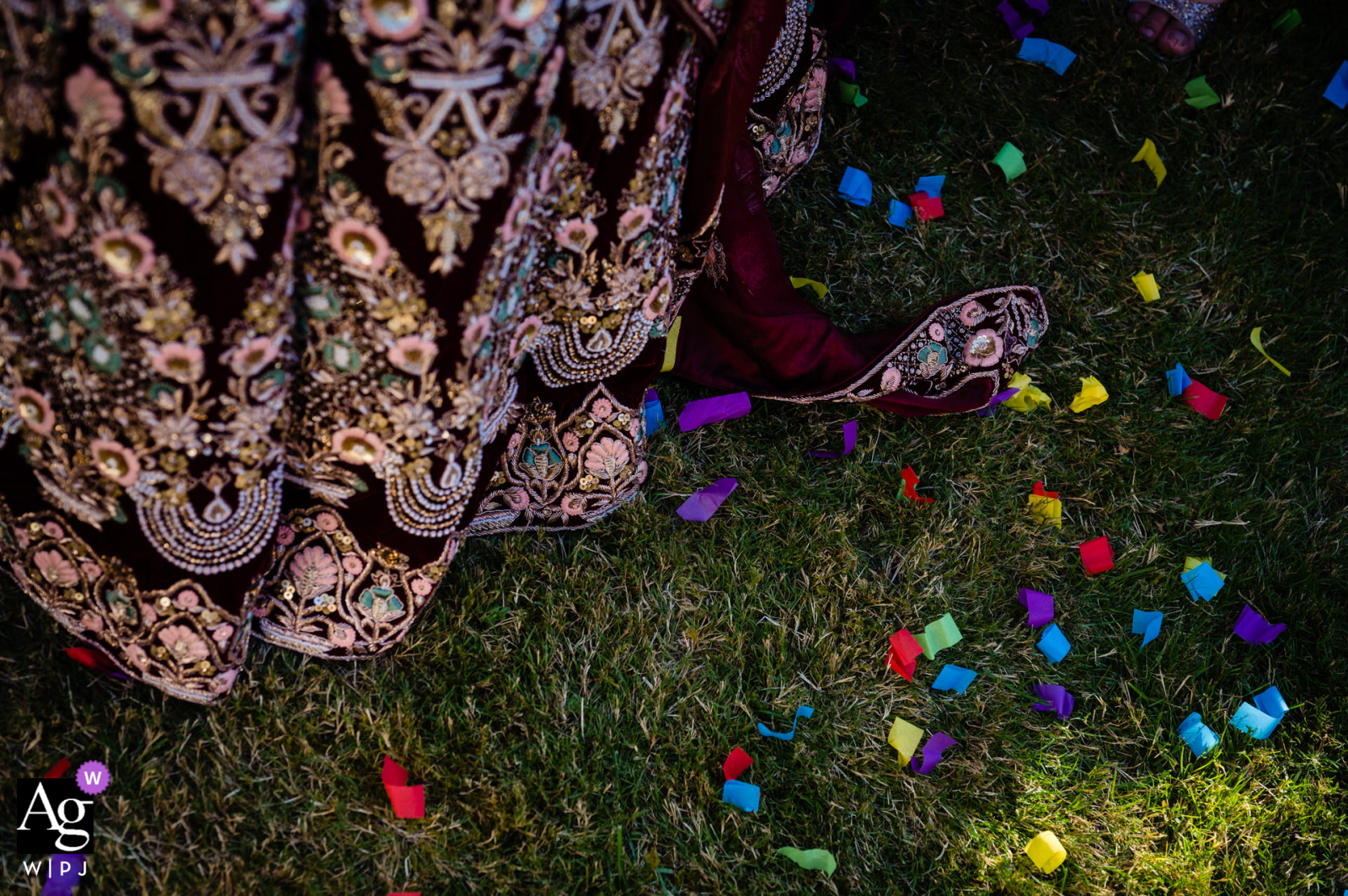 Birmingham, UK Dress and confetti artistic wedding detail image on the grass