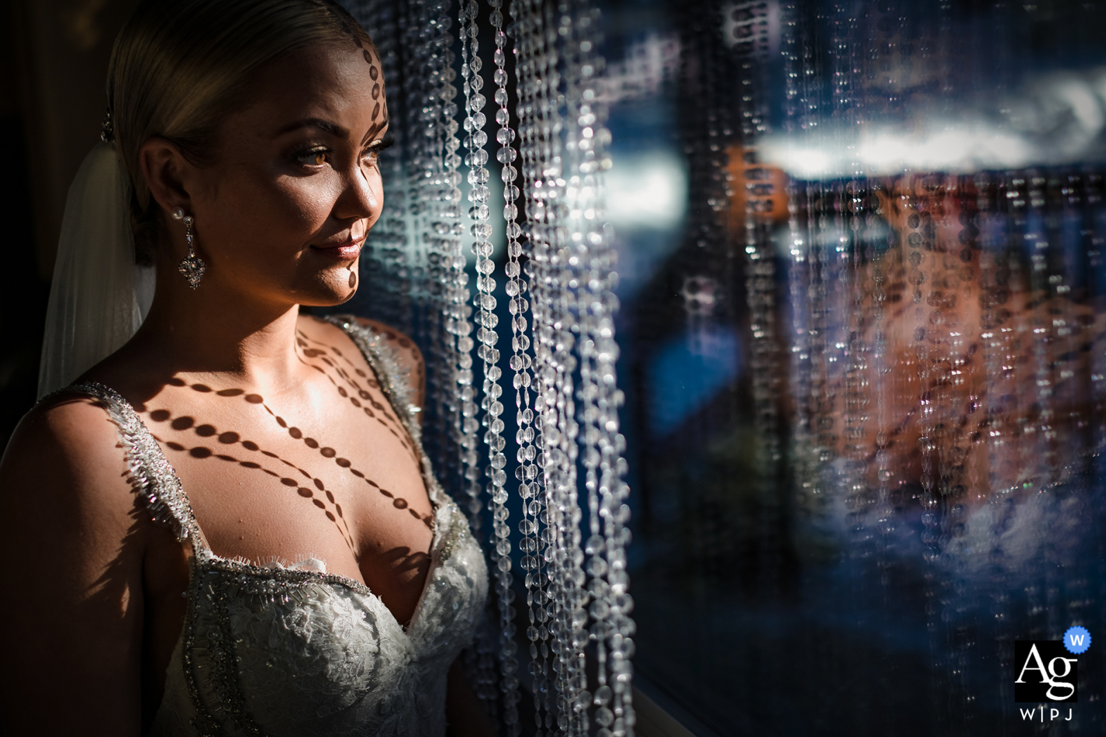 Lake Tahoe, Neveda creative wedding bridal portrait session with beads and window light shadows