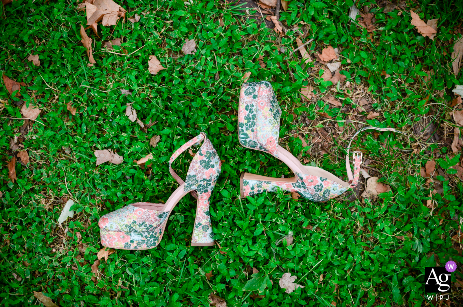 Sow Exotic Farm in Winter Haven, FL fine art wedding flowered shoes detail image of Bride's shoes in the grass before the ceremony begins