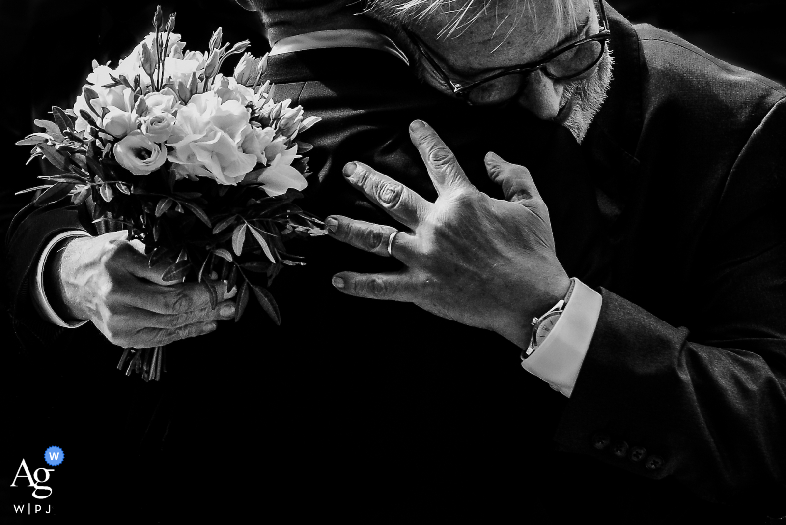Lille, Hauts-de-France fine art wedding flowers picture showing The father of the bride making a hug to the groom Lille, Hauts-de-France fine art wedding flowers picture showing The father of the bride making a hug to the groom