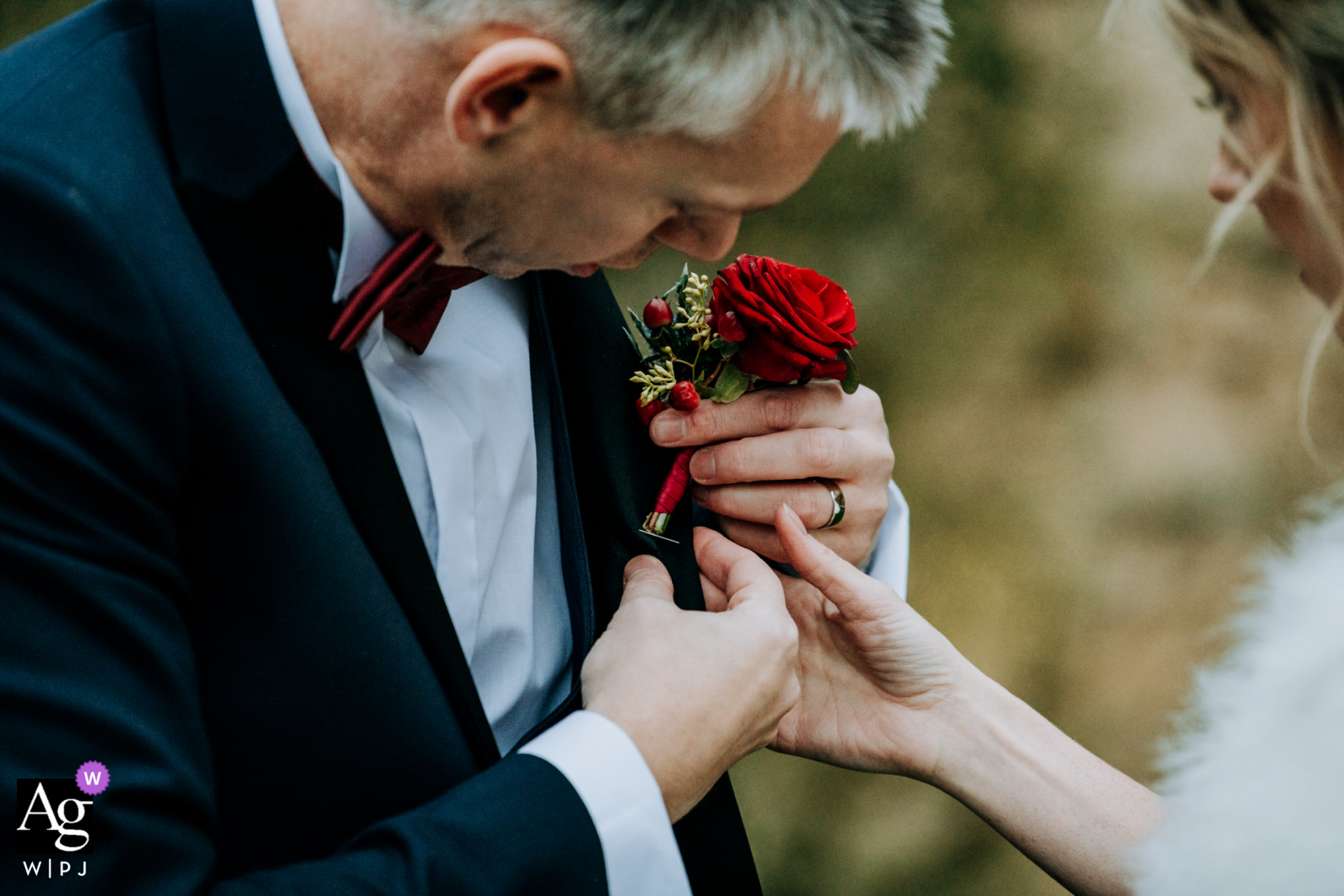 Rudding Park, North Yorkshire, UK wedding reportage image of the Bride assisting groom as he tries to re-attach his buttonhole Rudding Park, North Yorkshire, UK wedding reportage image of the Bride assisting groom as he tries to re-attach his buttonhole