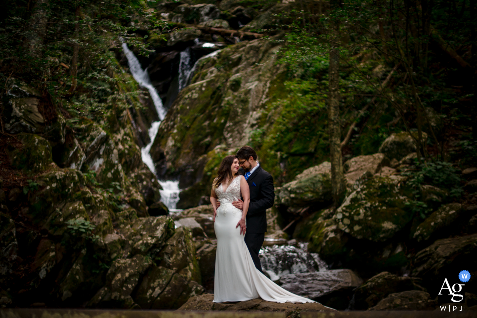 VA artistic wedding photo from Shenendoah, Virginia created as the Couple embraces in front of a waterfall VA artistic wedding photo from Shenendoah, Virginia created as the Couple embraces in front of a waterfall